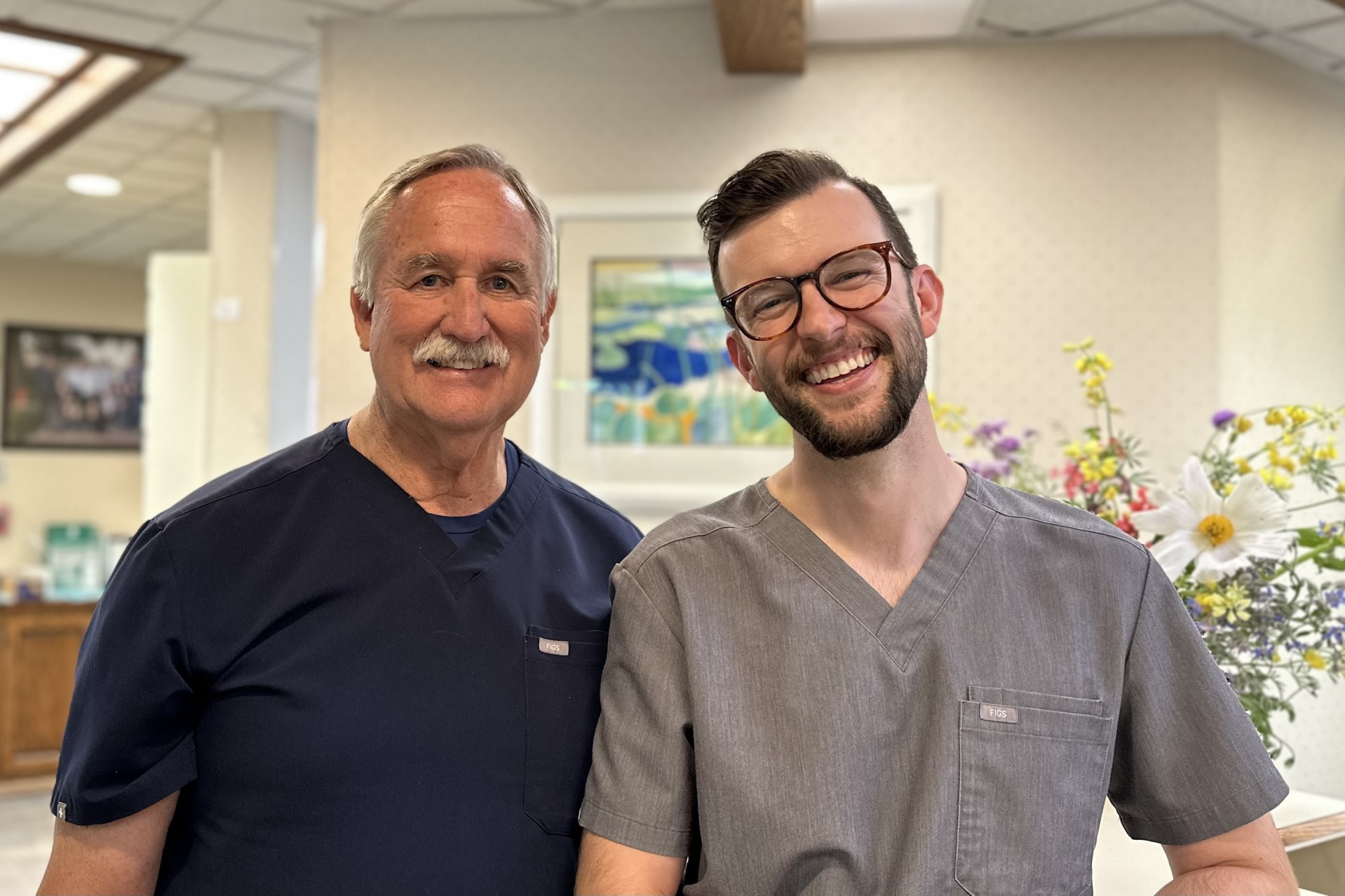 Dr. Olson and Dr. Courtin smiling in the waiting room