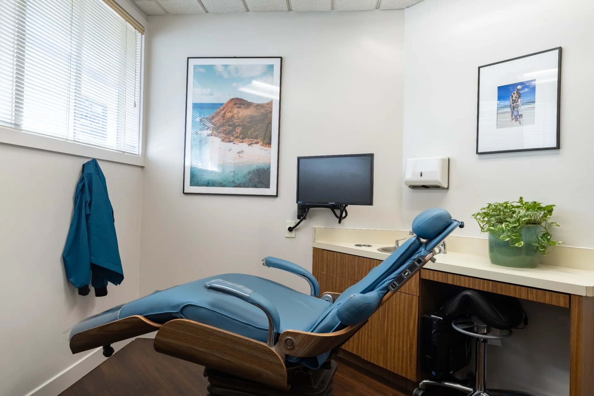 Modern dental treatment room with patient chair and clinical equipment