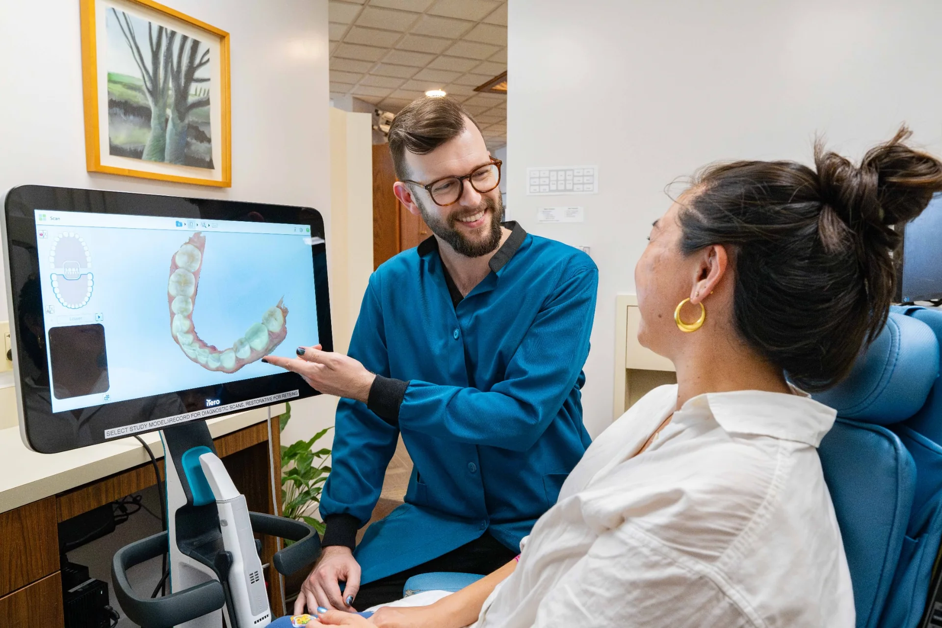 Dentist reviewing a digital dental scan with a patient